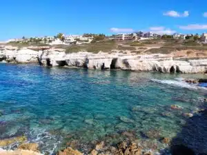 A body of water with buildings on the side.